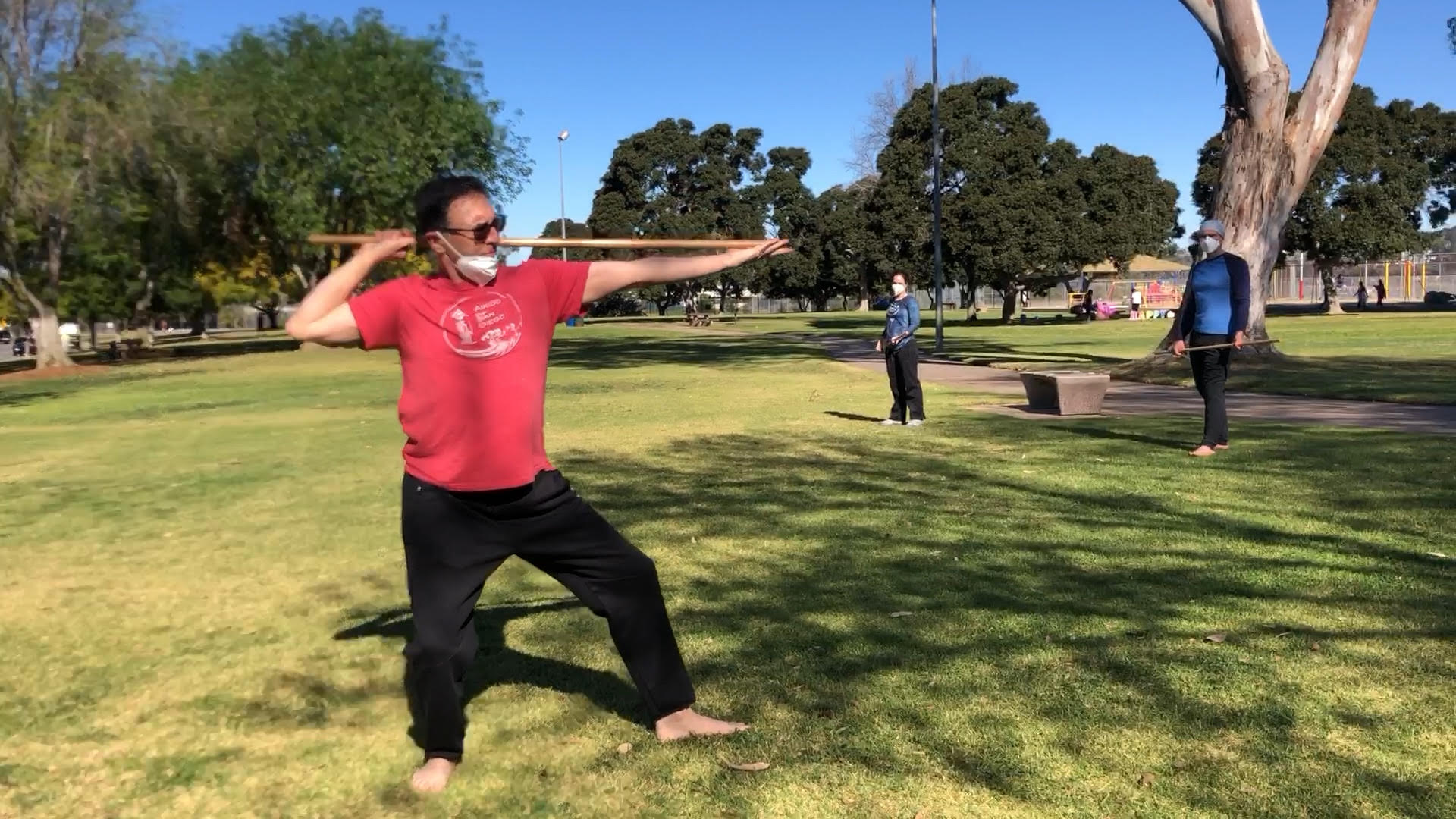 Dave Goldberg Sensei of Aikido of San Diego, teaching one of the jo suburi: katate toma-uchi, outdoors in the park during the Covid pandemic.
